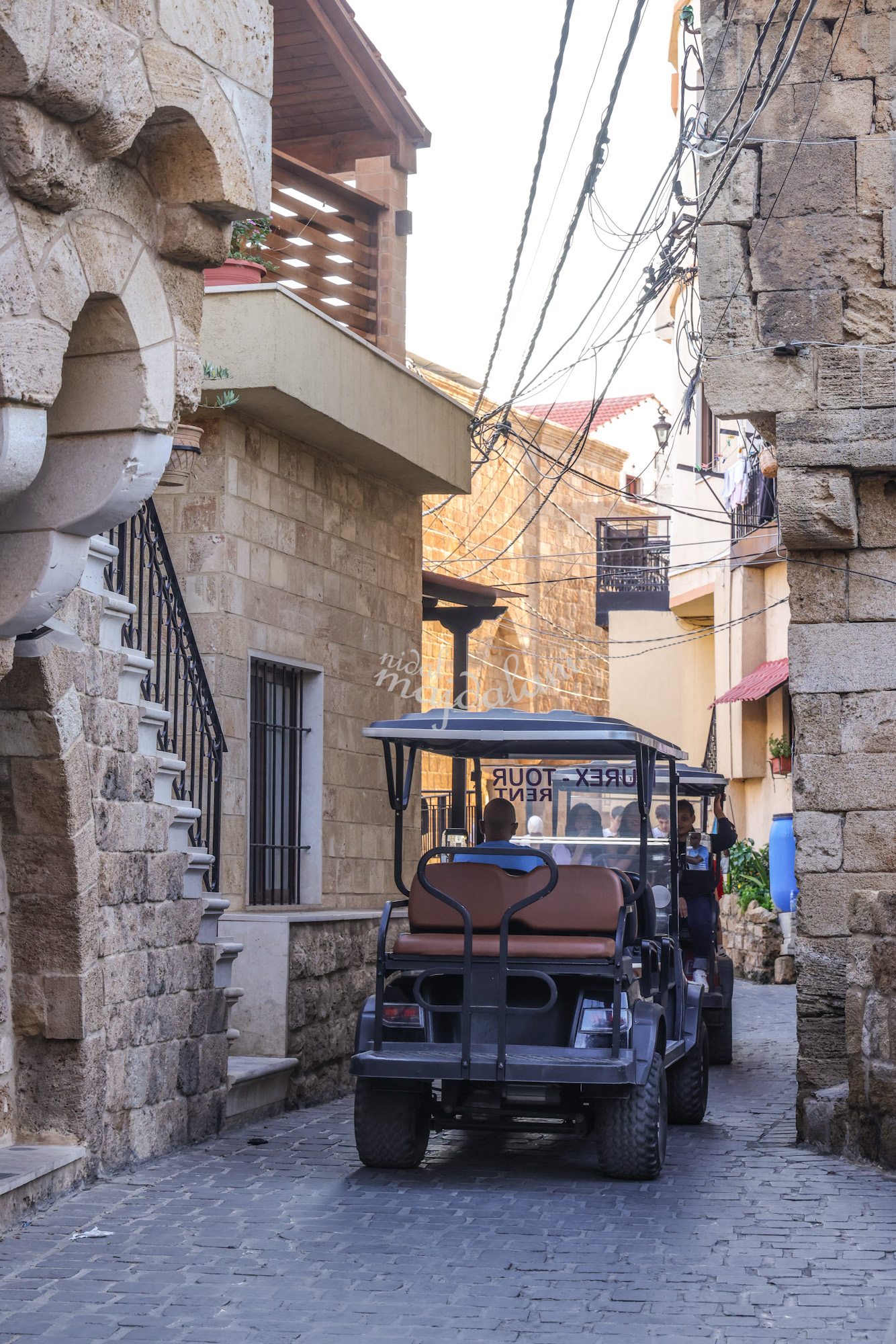 Golf cart transport through the narrow streets of Batroun Old Town