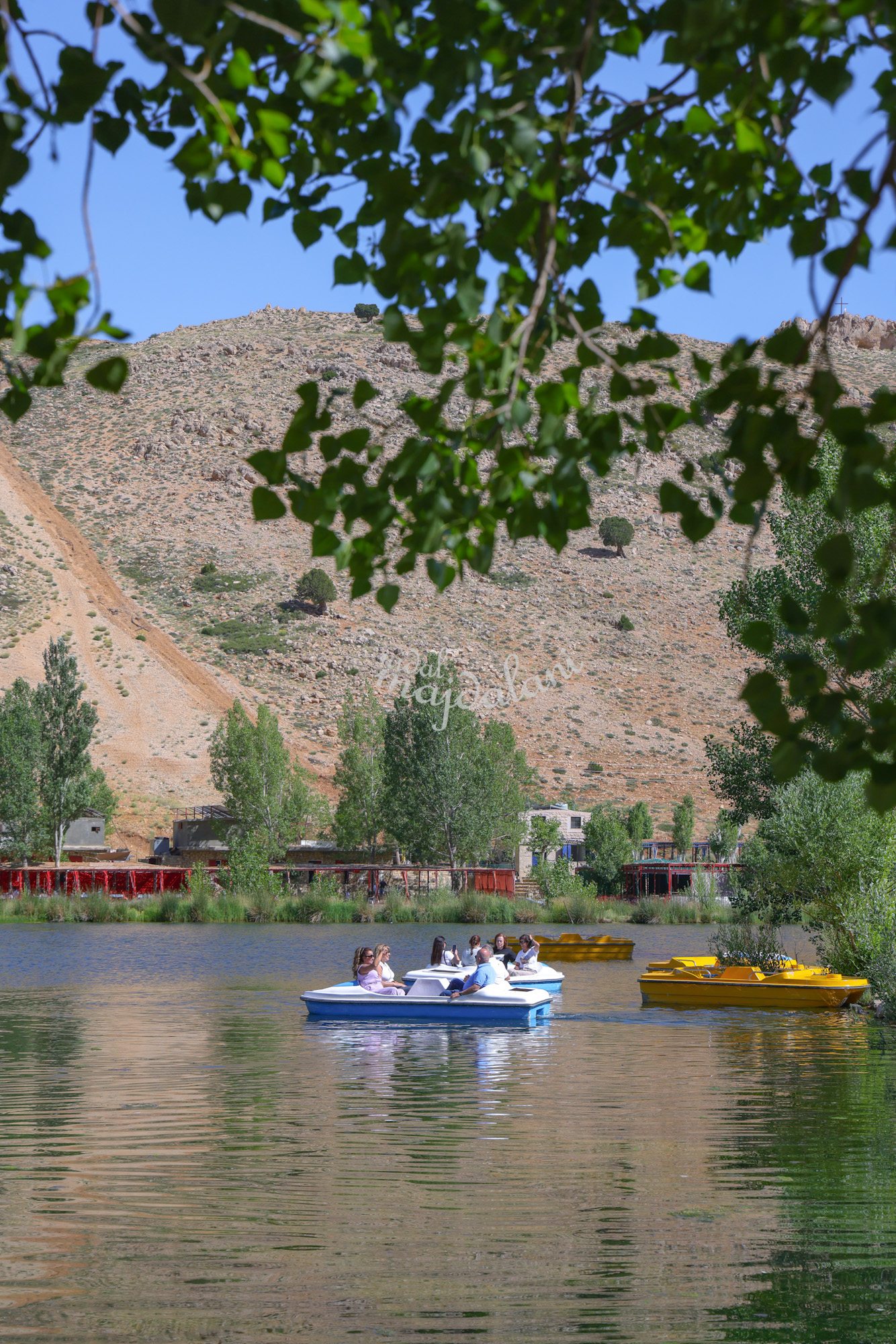 Oyoun Orghosh ponds with pedal boats and mountain views